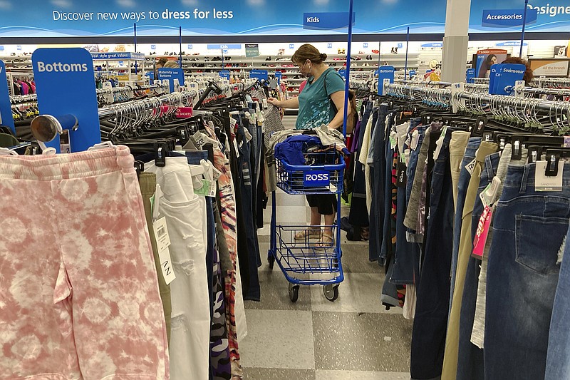 In this July 21, 2021 photo, a consumer shops at a retail store in Morton Grove, Ill.  Consumer prices rose 0.4% last month, slightly higher than August&#x2019;s gain and pushing annual inflation back to the highest increase in 13 years. The consumer price index rose 5.4% in September from a year ago, up slightly from August&#x2019;s gain of 5.3% and matching the increases in June and July.  (AP Photo/Nam Y. Huh)