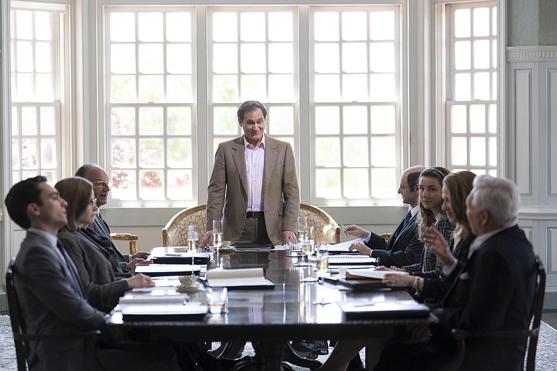 Michael Stuhlbarg (center) addresses colleagues in a scene from “Dopesick,” an eight-part miniseries about America’s opioid crisis, now streaming on Hulu. (Hulu via AP/Gene Page)