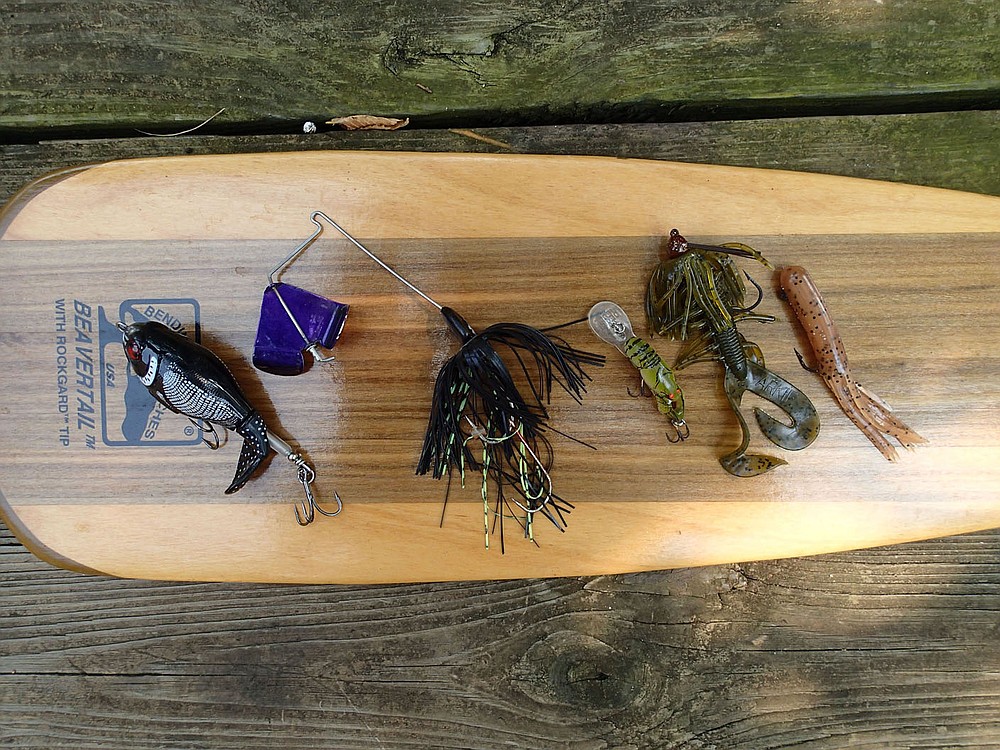 Good lures for fishing the Elk River or any Ozark stream include a Whopper Plopper (from left), buzz bait, Rebel Wee Crawfish, crawling grub and tube bait.  (NWA Democrat-Gazette/Flip Putthoff)