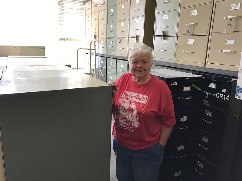 Miller County Circuit Clerk Mary Pankey stands in one of two storage rooms on the courthouse’s third floor that hold 75 file cabinets containing original paper copies of civil, criminal and domestic court case records. These records will soon be scanned, digitized and converted into electronic records for the public. (Staff photo by Greg Bischof)