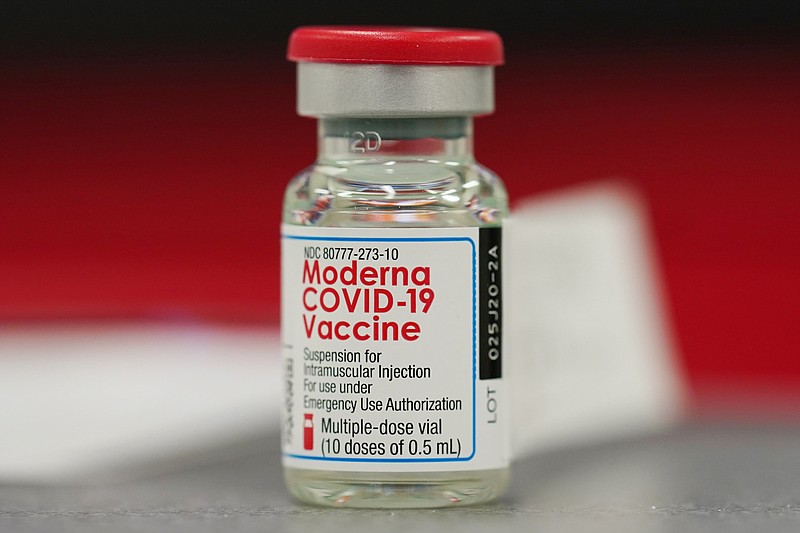 FILE - This Wednesday, Dec. 23, 2020 file photo shows a vial of the Moderna COVID-19 vaccine in the first round of staff vaccinations at a hospital in Denver. On Thursday, Oct. 14, 2021, U.S. health advisers said that some Americans who received Moderna&#x2019;s COVID-19 vaccine should get a half-dose booster to bolster protection against the virus. (AP Photo/David Zalubowski, File)