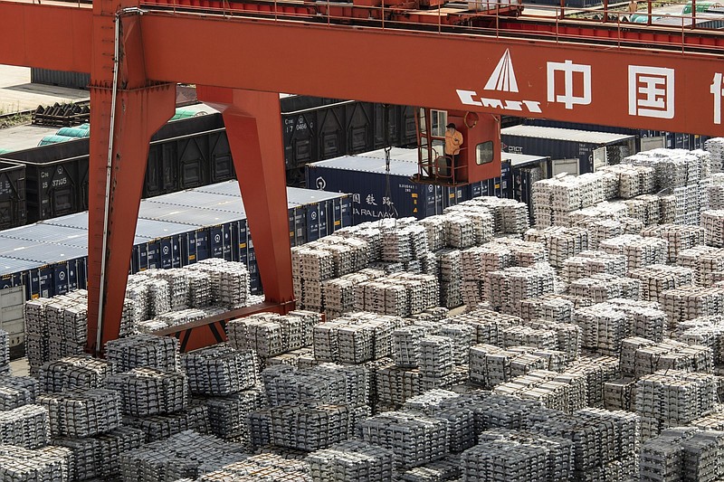 Piles of aluminum ingots sit at a stockyard in Wuxi, Jiangsu province, China, on Sept. 30, 2021. MUST CREDIT: Bloomberg photo by Qilai Shen