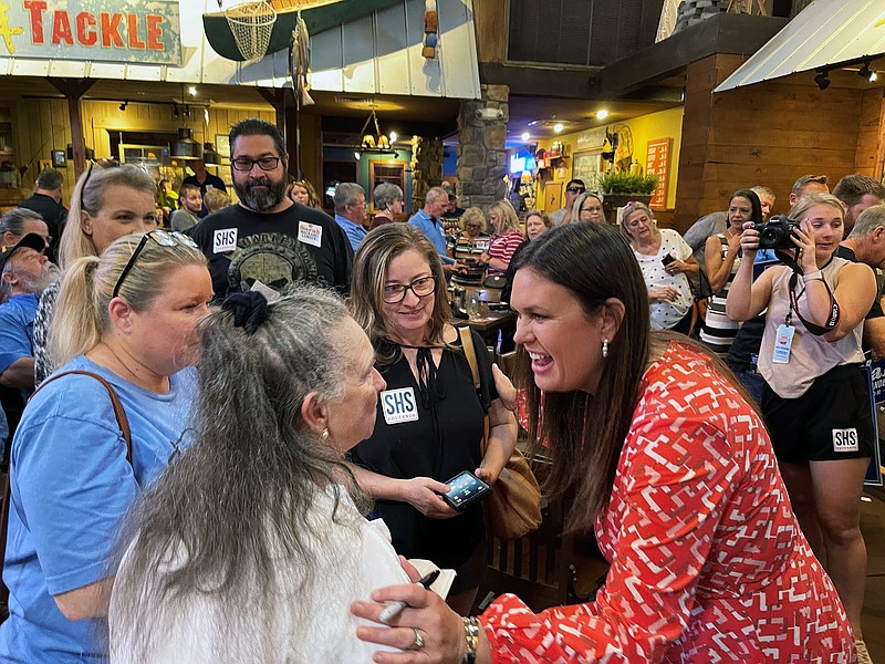 FILE - In this Sept. 10, 2021, file photo, former White House press secretary Sarah Sanders, right, greets supporters at an event for her campaign for governor at a Colton's Steak House in Cabot, Ark. Sanders has raised $2.1 million over the past three months in her bid to be Arkansas' next governor, her campaign announced Thursday, Oct. 14, 2021. (AP Photo/Andrew DeMillo)