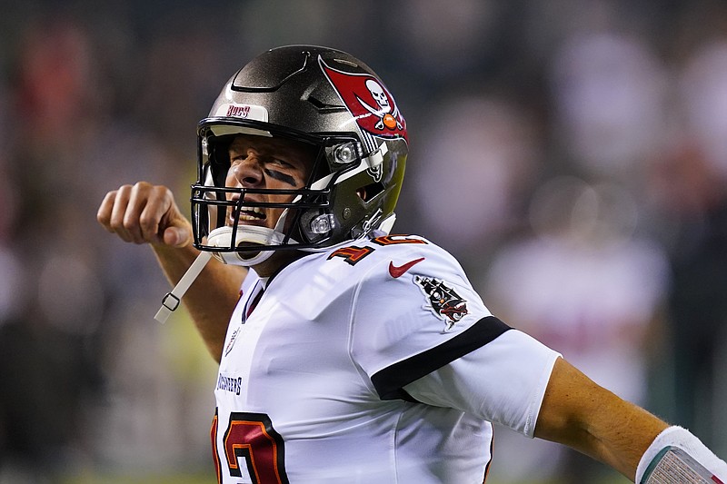 Tampa Bay Buccaneers quarterback Tom Brady shouts as he runs on to the field before an NFL football game against the Philadelphia Eagles, Thursday, Oct. 14, 2021, in Philadelphia. (AP Photo/Matt Rourke)