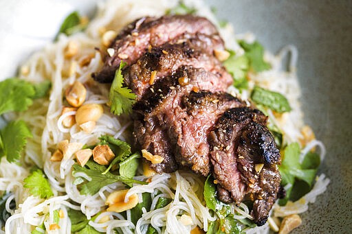 This image released by Milk Street shows a recipe for ginger beef and rice noodle salad. (Milk Street via AP)