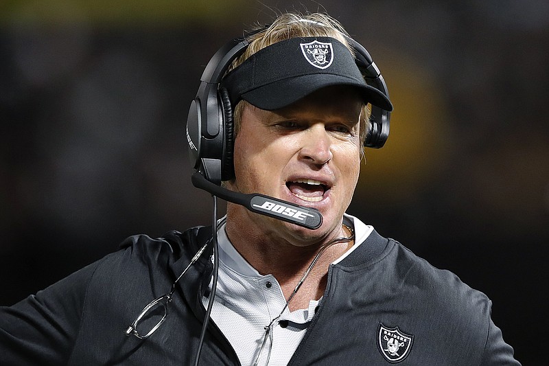 FILE - In this Aug. 10, 2018, file photo, Oakland Raiders coach Jon Gruden reacts during the first half of an NFL preseason football game against the Detroit Lions in Oakland, Calif. Current or former players, along with people in positions of leadership with NFL clubs, have offered differing opinions this week on how pervasive the sorts of racist, homophobic and misogynistic thoughts expressed by Jon Gruden -- in emails he wrote from 2011-18, when he was an ESPN analyst between coaching jobs, to then-Washington club executive Bruce Allen &#x2013; remain around the sport to this day. (AP Photo/John Hefti, File)