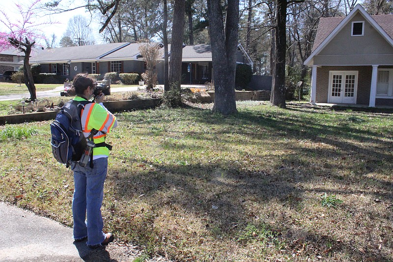 A Terracon Consultant Services agent works to survey the Mellor Park neighborhood