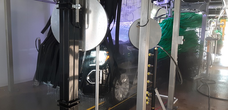 A customer vehicle begins the automated wash journey through the tunnel at FusionMax Car Wash & Lube. (Staff photo by Junius Stone)