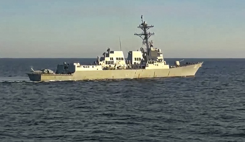 In this photo taken from video released by Russian Defense Ministry Press Service, the U.S. destroyer USS Chafee is seen form Russian navy's Admiral Tributs destroyer near Russian territorial waters in the Sea of Japan on Friday, Oct. 15, 2021. Russia's Defense Ministry says a Russian warship has prevented a U.S. Navy destroyer from what it described as an attempt to intrude into Russian territorial waters in the Sea of Japan. The ministry charged that the Russian navy's Admiral Tributs destroyer closely approached the U.S. destroyer USS Chafee to force it out of the area Friday near Russian waters that was declared off limits to shipping due to a Russian artillery drills. (Russian Defense Ministry Press Service via AP)