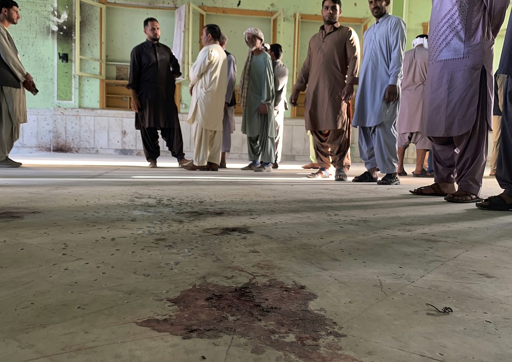 Blood stains are seen inside of a mosque following a suicide bombers attack in the city of Kandahar, southwest Afghanistan, Friday, Oct. 15, 2021. Suicide bombers attacked a Shiite mosque in southern Afghanistan that was packed with worshippers attending Friday prayers, killing several people and wounding others, according to a hospital official and a witness.(AP Photo/Sidiqullah Khan)