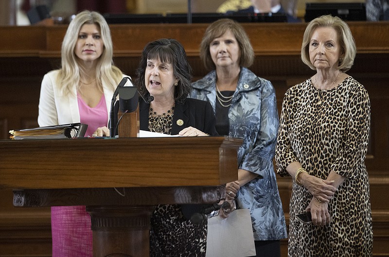State Rep. Valoree Swanson, R-Spring, second from left, speaks in favor of House Bill 25, which she authored, that limits the participation of transgender athletes in public school sports, in the House Chamber at the Capitol in Austin, Texas, on Thursday Oct. 14, 2021. Behind her are state representatives Lacey Hull, R - Houston, left to right, Candy Noble, R - Lucas, and Geanie Morrison, R - Victoria. (Jay Janner /Austin American-Statesman via AP)