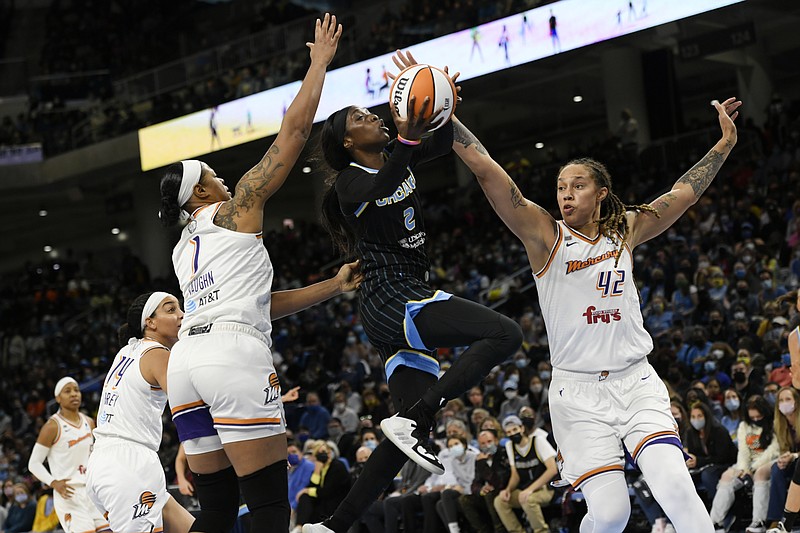 Chicago Sky's Kahleah Copper (2) goes up to shoot the basketball against Phoenix Mercury's Brittney Griner (42) and Kia Vaughn (1) during the first half of Game 3 of the WNBA Finals, Friday, Oct. 15, 2021, in Chicago. (AP Photo/Paul Beaty)