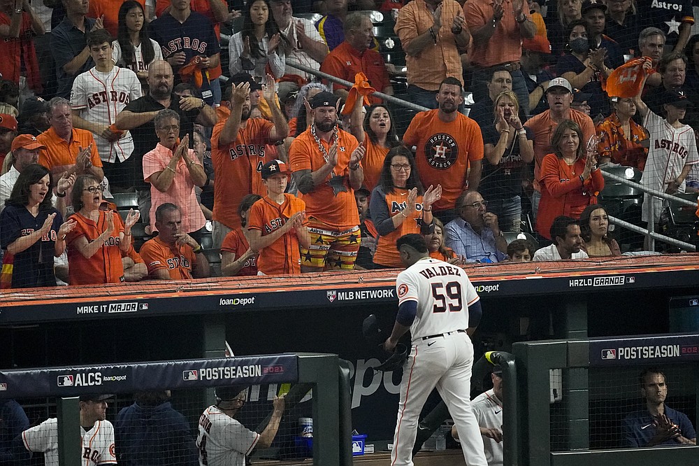 Fans react after Houston Astros starting pitcher Framber Valdez is taken out of the game against the Boston Red Sox during the third inning in Game 1 of baseball's American League Championship Series Friday, Oct. 15, 2021, in Houston. (AP Photo/Sue Ogrocki)