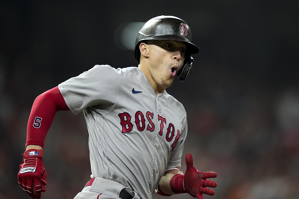 Boston Red Sox's Enrique Hernandez celebrates after a home run against the Houston Astros during the third inning in Game 1 of baseball's American League Championship Series Friday, Oct. 15, 2021, in Houston. (AP Photo/David J. Phillip)