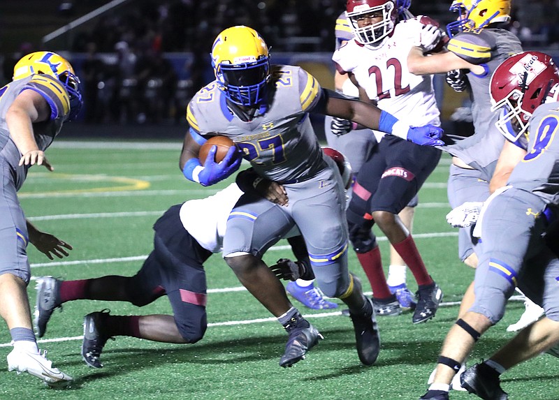 Lakeside's Braylen Russell (27) runs the ball against Hope Friday at Chick Austin Field. - Photo by Richard Rasmussen of The Sentinel-Record