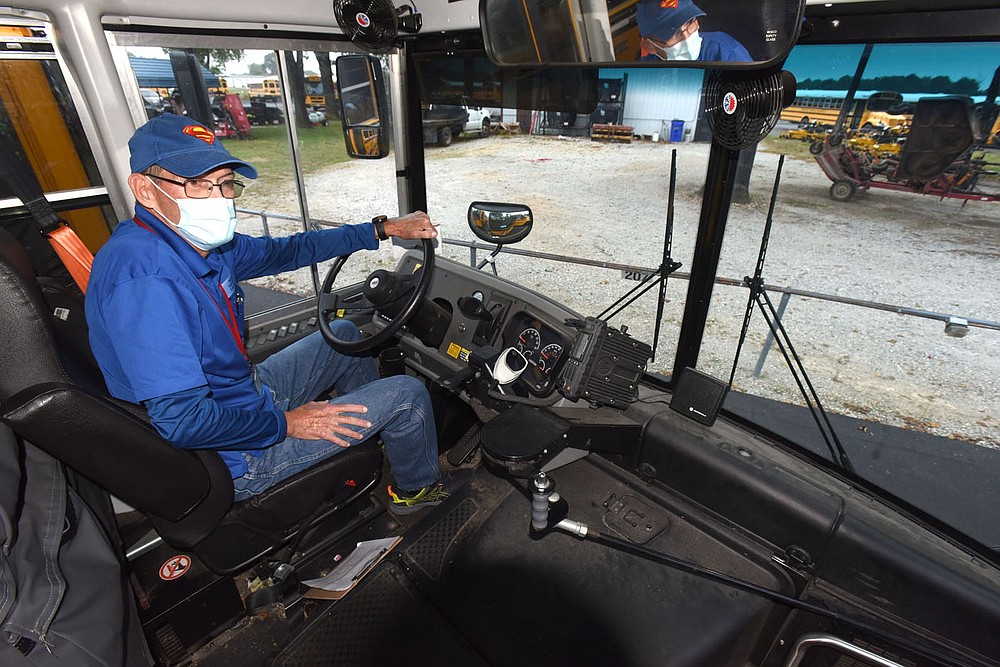 Lee Stubblefield sits on Wednesday Oct. 6 2021 behind the wheel of bus No. 46, the bus he drives for the Rogers School District. Stubblefield has been a school bus driver for 28 years.
(NWA Democrat-Gazette/Flip Putthoff)