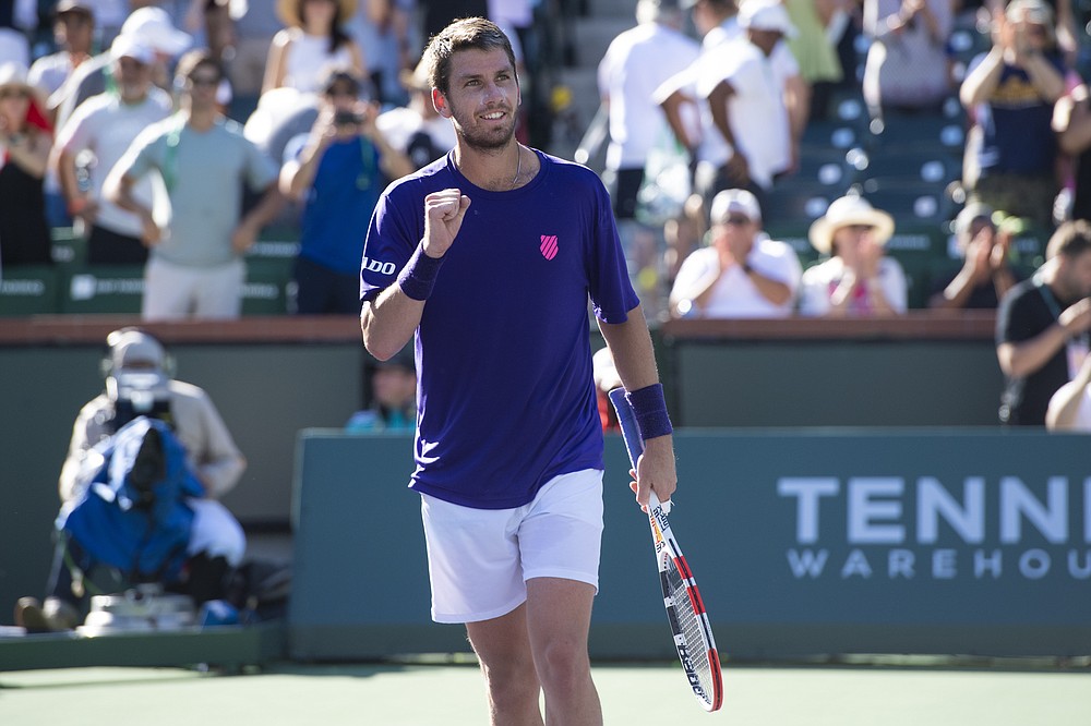 Cameron Norrie, of Britain, looks to the crowd after winning a semifinal match Saturday, Oct. 16, 2021, in Indian Wells, Calif. (AP Photo/John McCoy)