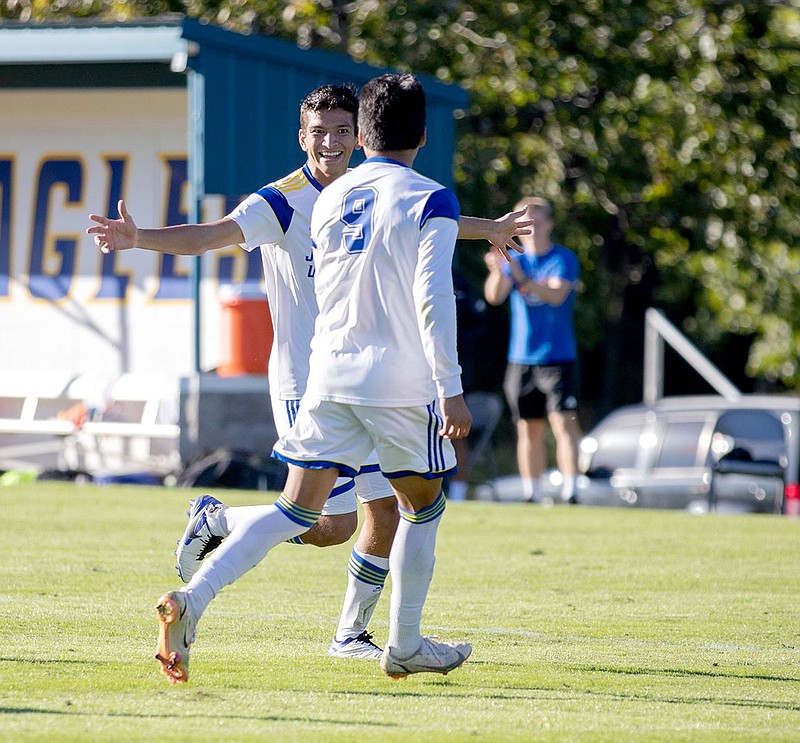 Photo courtesy of JBU Sports Information
John Brown freshman Kendall Acuna and junior Jacob Zamarron celebrate after a JBU goal during Monday's match against Oklahoma Panhandle State.