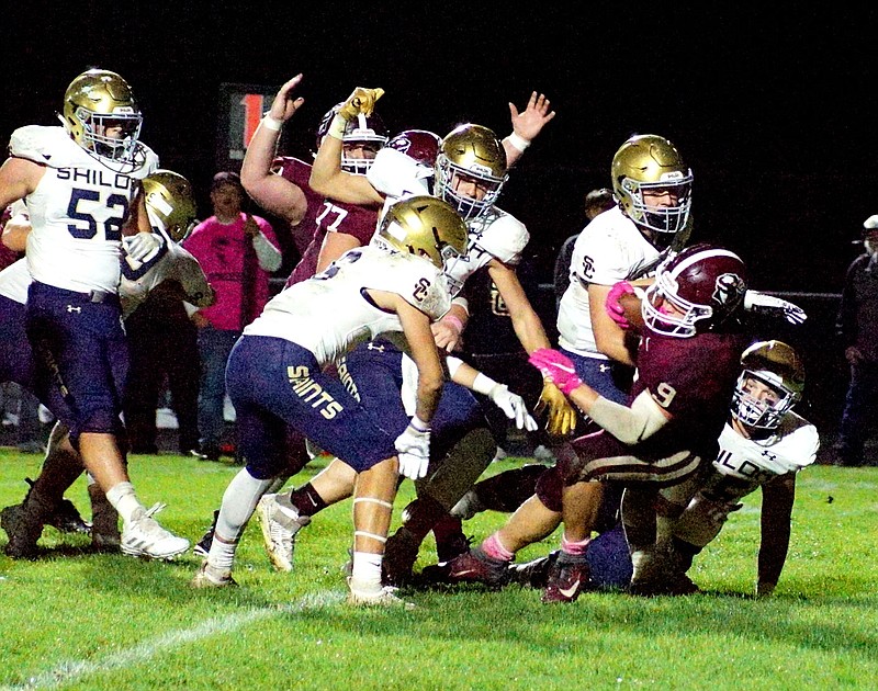 Westside Eagle Observer/RANDY MOLL
Gentry's  Zach Gunneman powers his way through the Shiloh Christian line for a 5-yard run across the goal line to make it 14-13, Saints, with 5:29 left in the second quarter of the Gentry-Shiloh Christian football game in Pioneer Stadium on Friday.