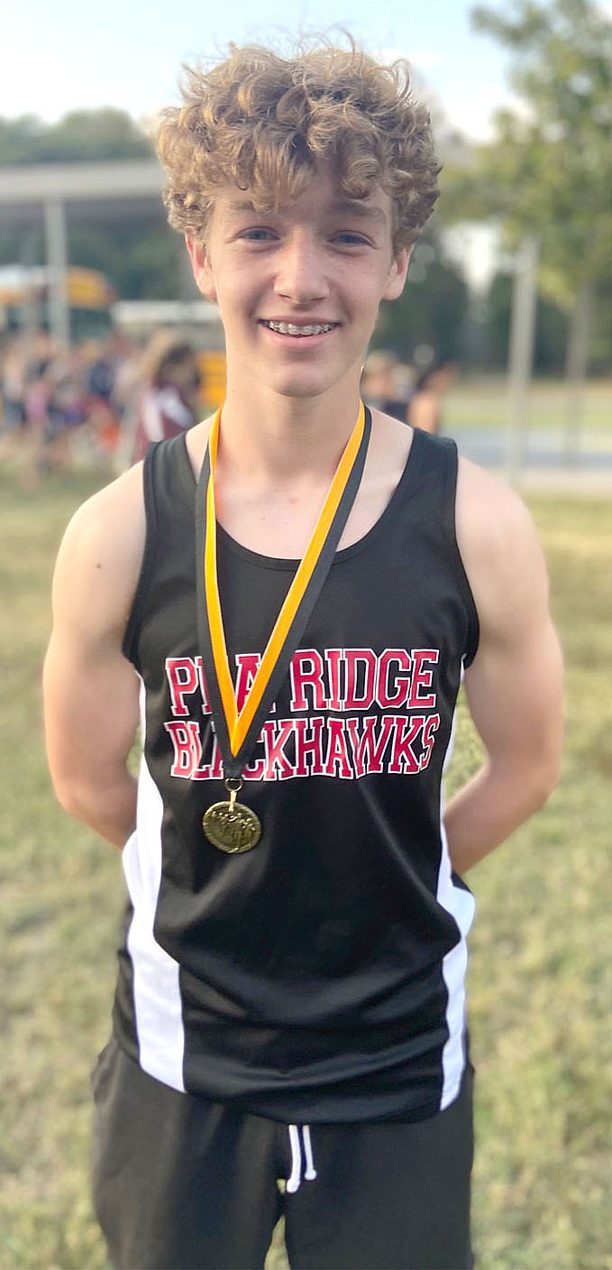 Junior Blackhawk boys cross country team runner Trey Bounds won eighth place in the 1A-4A-5A Prairie Grove Invitational Tuesday, Oct. 12.