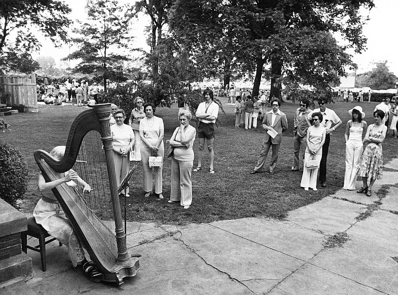 Sue Taylor, a harpist with the Arkansas Symphony, performs as a prelude to the Arkansas Opera Theater production of "The Mikado" at the second Marlsgate Opera Theater at Marlsgate, the Dortch Plantation at Scott. Arkansas Gazette, Sunday, May 23, 1976. Photo shot by Steve Keesee. 
(Democrat-Gazette archives)