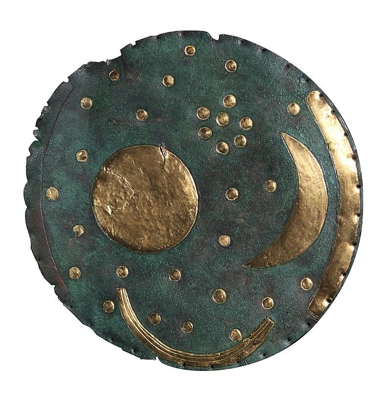 This image courtesy of the State Office for Heritage Management and Archaeology Saxony-Anhalt shows the Nebra Sky Disc. The British Museum will display what it says is the world&#x2019;s oldest surviving map of the stars in a major upcoming exhibition on the Stonehenge stone circle. The 3,600-year-old &#x201c;Nebra Sky Disc,&#x201d; first discovered in Germany in 1999, is one of the oldest surviving representations of the cosmos in the world and has never before been displayed in the U.K., the London museum said Monday. (Juraj Liptak/State Office for Heritage Management and Archaeology Saxony-Anhalt via AP)