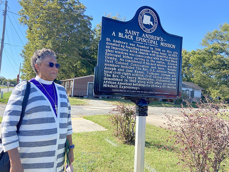 The Rev. Phoebe Roaf, Episcopal bishop of West Tennessee, stands near the sign designating the site where St. Andrew's Episcopal Church once stood. (Special to The Commercial/Deborah Horn)