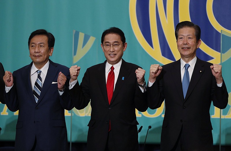 Leaders of Japan's main political parties, the Constitutional Democratic Party of Japan leader Yukio Edano, left, Prime Minister and ruling Liberal Democratic Party President Fumio Kishida, center, Komeito party leader Natsuo Yamaguchi  attend a debate session ahead of Oct. 31, 2021 lower house election, at the Japan National Press Club in Tokyo Monday, Oct. 18 , 2021. (Issei Kato/Pool Photo via AP)