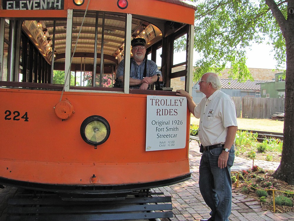 Fort Smith Trolley Museum Manager Bradley Martin, right, talks with volunteer operator Bill Buchanan during a stop at the trolley station behind the museum. The restored trolley No. 224 once trundled down the streets of Fort Smith in the early 20th Century.Arkansas Democrat-Gazette/DAVE HUGHES