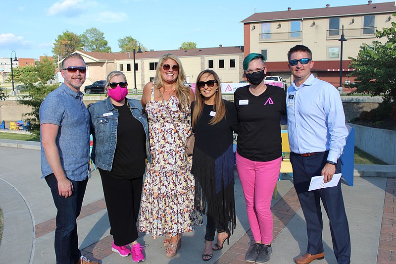 Brandon Hamilton (from left); Anne Jackson, Arts One Presents executive director; Mandy Macke; Tareneh Manning; Nikki Cathcart-Sievert; and Derek Gibson welcome guests to the Arts One Presents kickoff celebration Oct. 7 at Walter Turnbow Park in Springdale.
(NWA Democrat-Gazette/Carin Schoppmeyer)