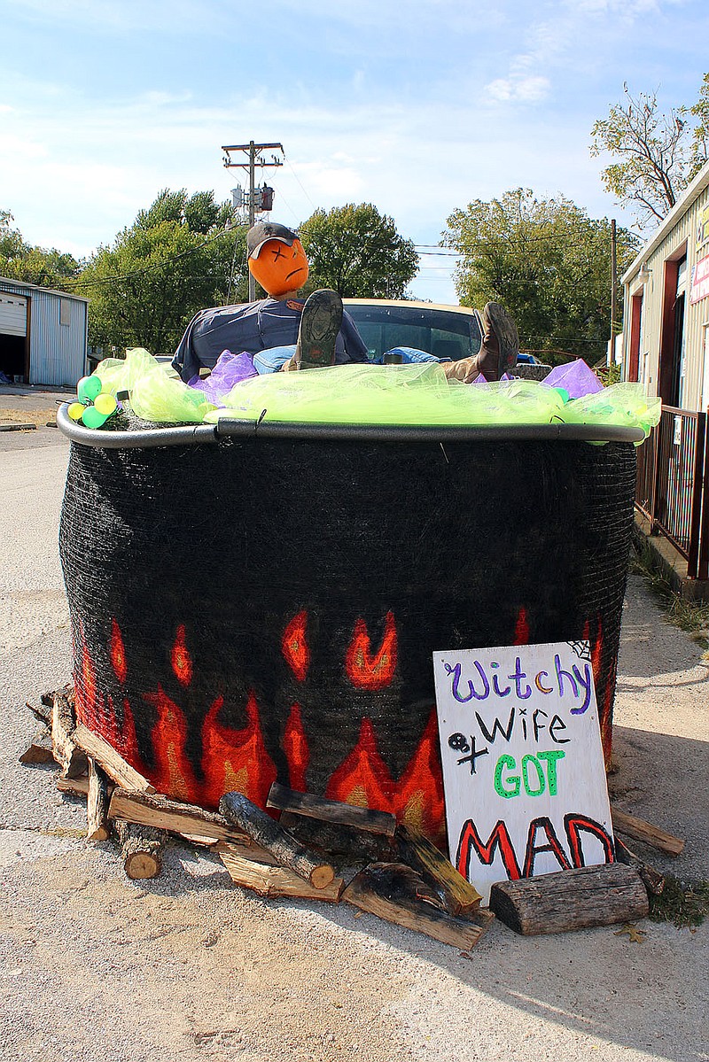 MEGAN DAVIS/MCDONALD COUNTY PRESS This display by Country Boy Tire and Auto includes a witch's cauldron and what seems to be a cautionary tale.