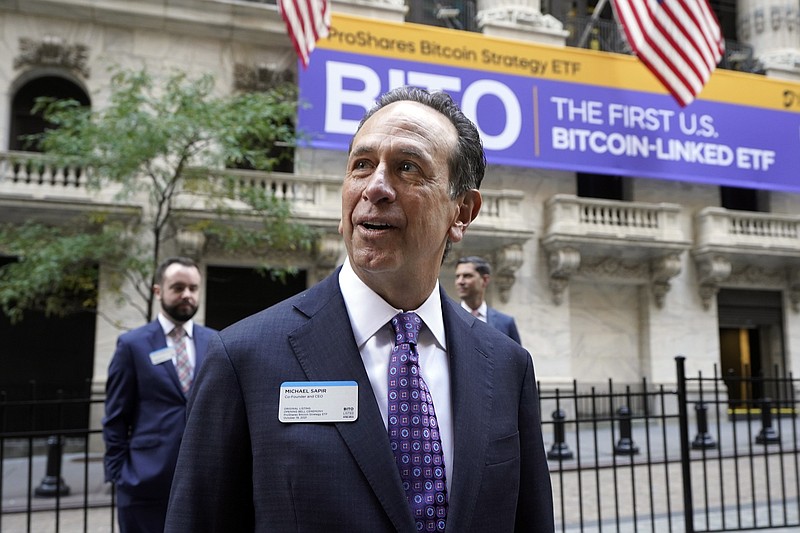 ProShares CEO Michael Sapir is photographed outside the New York Stock Exchange before his company is listed, Tuesday, Oct. 19, 2021. ProShares will launch the country's first exchange-traded fund linked to Bitcoin. (AP Photo/Richard Drew)
