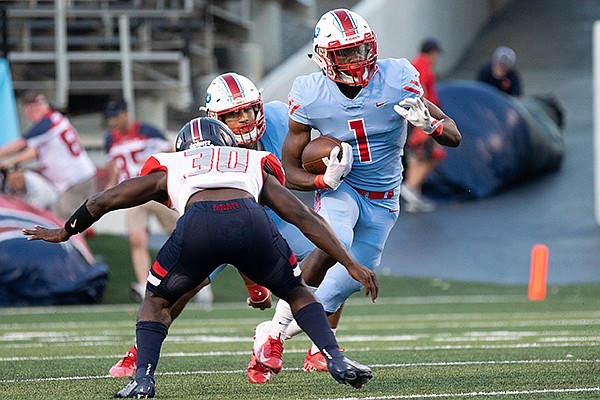 Arkansas Democrat Gazette/JUSTIN CUNNINGHAM - 09-13-2019 - Little Rock Parkview running back James Jointer (R) trying to avoid tackle by Marion linebacker Antonio Grays (L) during first quarter action at in Little Rock War Memorial Stadium, September 13, 2019.