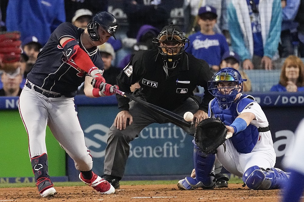 Atlanta Braves' Joc Pederson hits an RBI single during the third inning against the Los Angeles Dodgers in Game 4 of baseball's National League Championship Series Wednesday, Oct. 20, 2021, in Los Angeles. (AP Photo/Marcio Jose Sanchez)