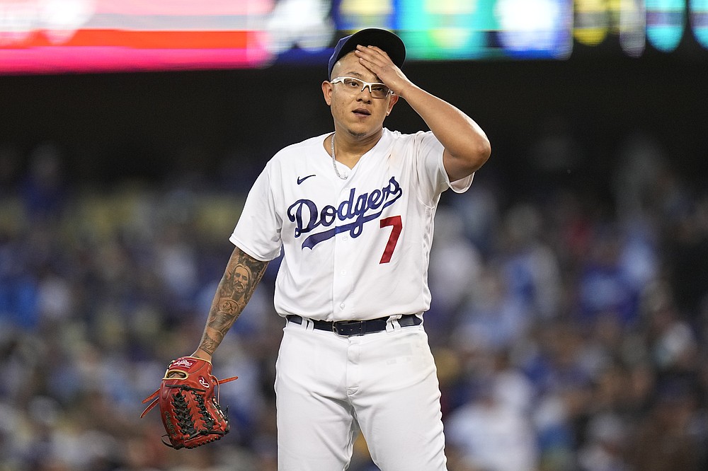 Los Angeles Dodgers pitcher Julio Urias reacts after giving up an RBI single to Atlanta Braves' Joc Pederson during the third inning in Game 4 of baseball's National League Championship Series Wednesday, Oct. 20, 2021, in Los Angeles. (AP Photo/Jae Hong)