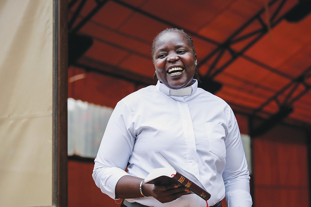 Associate Pastor Caroline Omolo stands for a portrait at the Cosmopolitan Affirming Community church, which serves a predominantly LGBTQ congregation, in Nairobi, Kenya, on Monday, Oct. 11, 2021. She says some faculty and students at Kenya's theological schools support her church, which has about 300 members. (AP Photo/Brian Inganga)