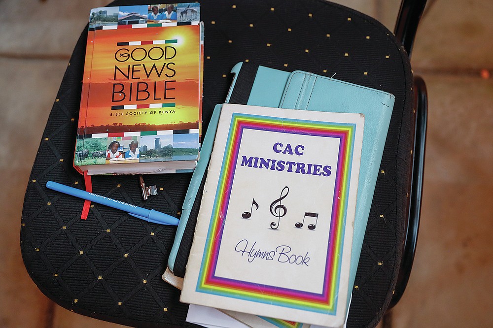 A hymn book and Bible are seen during a church service at the Cosmopolitan Affirming Community church, which serves a predominantly LGBTQ congregation, in Nairobi, Kenya, on Sunday, Oct. 17, 2021. “The mainstream churches – all of them – they actually are totally against it,” says Caroline Omolo, associate pastor at the church. It is a rare example of a church in Africa serving a predominantly LGBTQ congregation. (AP Photo/Brian Inganga)