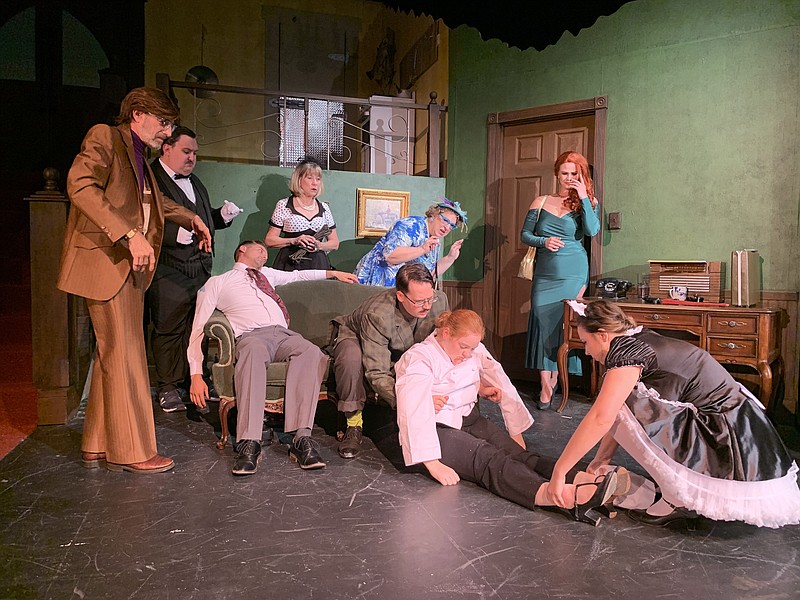 Mr. Green (Steven Vick) attempts to calm a distressed Mrs. Peacock (Traci Stevenson) during a dress rehearsal for the SAAC production of "Clue: On Stage." (Contributed)