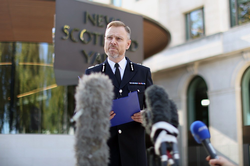 Metropolitan Police Assistant Commissioner Matt Jukes gives a statement outside New Scotland Yard in London in connection of the death of British lawmaker David Amess, in London, Thursday, Oct. 21, 2021. British authorities say a man has been charged with murder and preparing acts of terrorism in the stabbing of a Conservative lawmaker who was killed as he met constituents at a church hall last week Police say Ali Harbi Ali, a 25-year-old British man with Somali heritage, has been charged in the death of David Amess. (James Manning/PA via AP)