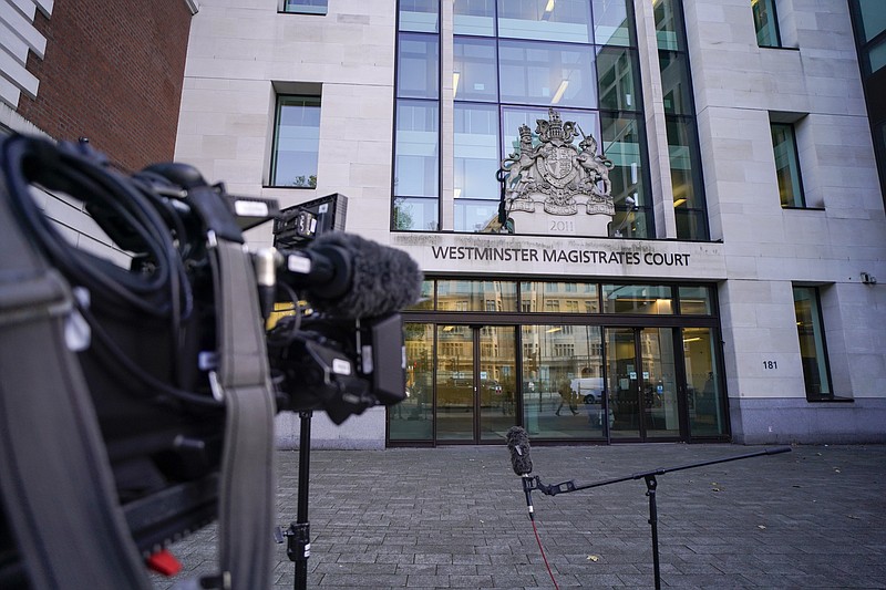 A television camera outside Westminster Magistrates Court, in London, Thursday, Oct. 21, 2021. British authorities say a man has been charged with murder and preparing acts of terrorism in the stabbing of a Conservative lawmaker who was killed as he met constituents at a church hall last week Police say Ali Harbi Ali, a 25-year-old British man with Somali heritage, has been charged in the death of David Amess.(AP Photo/Alberto Pezzali)