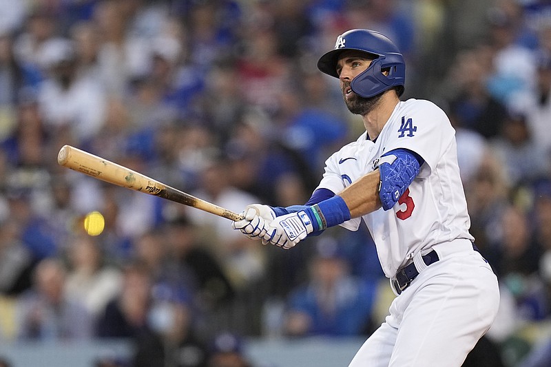 Los Angeles Dodgers' Chris Taylor watches his two-run home run in the second inning against the Atlanta Braves in Game 5 of baseball's National League Championship Series Thursday, Oct. 21, 2021, in Los Angeles. Pujols scored on the hit. (AP Photo/Jae C. Hong)