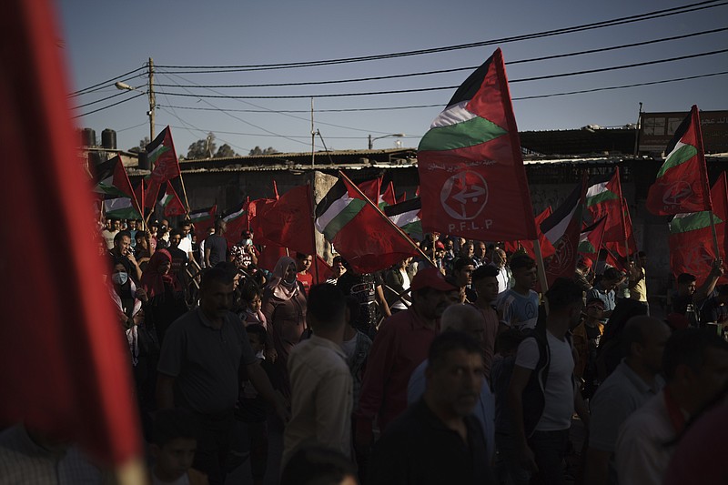 FILE - In this June 2, 2021 file photo, Palestinians attend a rally organized by the Popular Front for the Liberation of Palestine (PFLP), in Gaza City.  Israel on Friday, Oct. 22,  declared six prominent Palestinian human rights groups to be terrorist organizations, saying they were secretly linked to a left-wing militant movement. It was not immediately clear what the distinction would mean for the groups, most of which also protest rights violations by the Western-backed Palestinian Authority (AP Photo/Felipe Dana, File)
