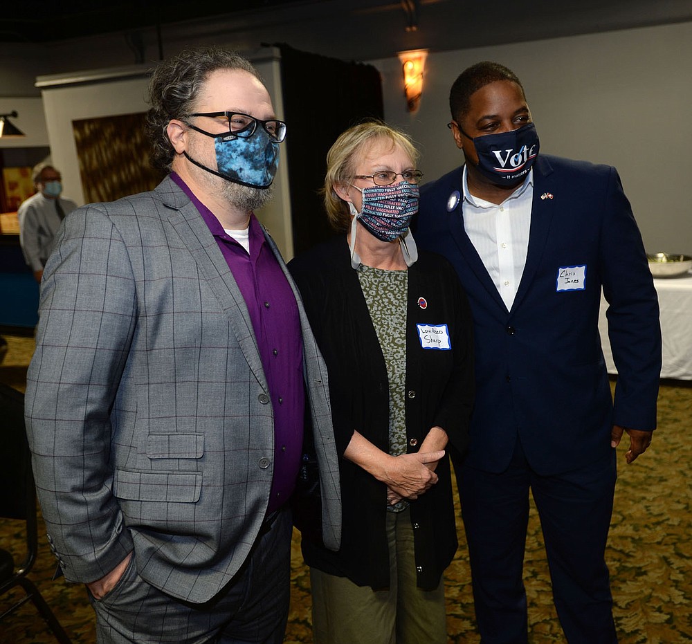 Two of the Democratic candidates for Arkansas governor James “Rus” Russell (left) and Chris Jones (right) pose Friday, Oct. 22, 2021, with Lou Reed Sharp during a candidate forum hosted by the Northwest Arkansas Political Animals at Mermaids restaurant in Fayetteville. The forum featured each Democratic candidate for Arkansas governor except Supha Xayprasith-Mays, who was invited but did not attend. Visit nwaonline.com/211023Daily/ for today's photo gallery.
(NWA Democrat-Gazette/Andy Shupe)