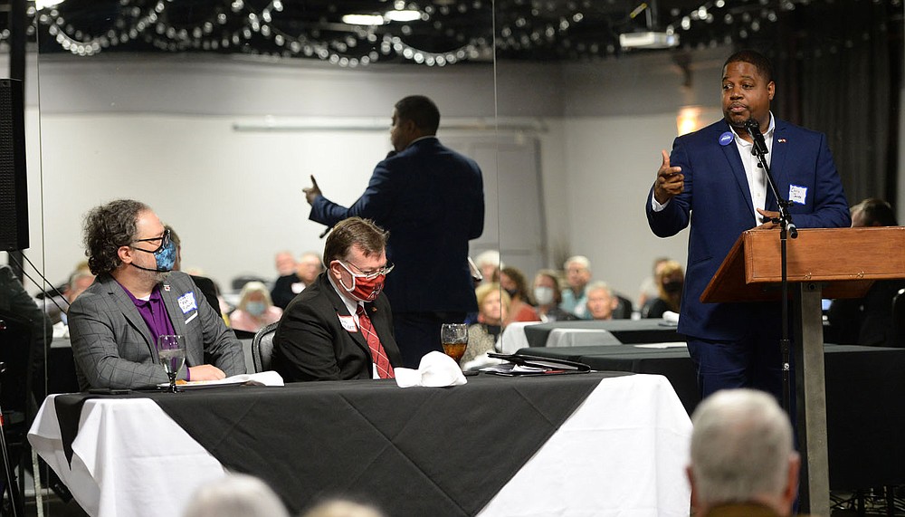 Chris Jones (right) and James “Rus” Russell (right), two of the Democratic candidates for Arkansas governor, speak Friday, Oct. 22, 2021, alongside Washington County Circuit Judge John Threet during a candidate forum that also featured candidate Anthony Bland and was hosted by the Northwest Arkansas Political Animals at Mermaids restaurant in Fayetteville. The forum featured each Democratic candidate for Arkansas governor except Supha Xayprasith-Mays, who was invited but did not attend. Visit nwaonline.com/211023Daily/ for today's photo gallery.
(NWA Democrat-Gazette/Andy Shupe)