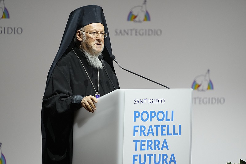 FILE - In this Oct. 6, 2021 file photo, Ecumenical Patriarch of Constantinople Bartholomew I delivers his speech at the interreligious meeting 'Brother peoples, future land&quot; organized by the Sant'Egidio Community at 'La Nuvola' (the cloud) convention center in Rome.   The spiritual leader of the world&#x2019;s 200 million Eastern Orthodox Christians brings an agenda spanning political, environmental and religious concerns to a 12-day U.S. visit beginning Saturday, Oct. 23.  (AP Photo/Gregorio Borgia, File)