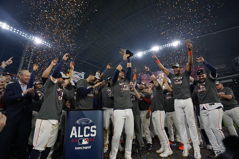 The Houston Astros celebrate their win against the Boston Red Sox n Game 6 of baseball's American League Championship Series Friday, Oct. 22, 2021, in Houston. The Astros won 5-0, to win the ALCS series in game six. (AP Photo/David J. Phillip)
