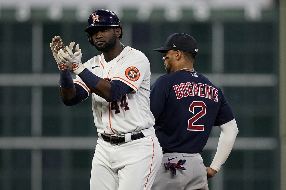 Houston Astros' Yordan Alvarez celebrates after s double against the Boston Red Sox during the fourth inning in Game 6 of baseball's American League Championship Series Friday, Oct. 22, 2021, in Houston. (AP Photo/David J. Phillip)
