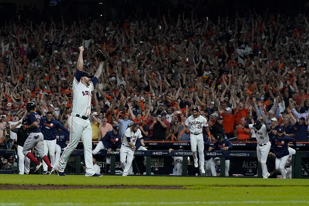 Houston Astros pitcher Ryan Pressly celebrates their win against the Boston Red Sox in Game 6 of baseball's American League Championship Series Friday, Oct. 22, 2021, in Houston. The Astros won 5-0, to win the ALCS series in game six. (AP Photo/David J. Phillip)