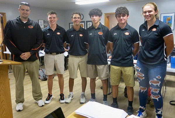 Westside Eagle Observer/SUSAN HOLLAND
Coach Bryan Bearden and members of the Gravette High School golf team are recognized at the Oct. 18 meeting of the Gravette school board after leading the pledge of allegiance to the flag to open the meeting. Pictured are Coach Bearden, Braxton Muldoon, Landon Joneson, McCoy Kildow, Isaiah Larson and Rachel Deihl.