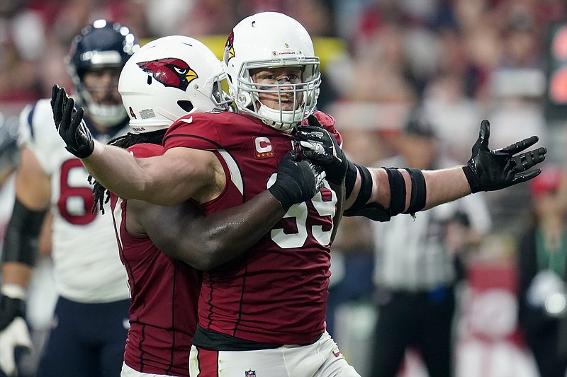 Arizona Cardinals defensive end J.J. Watt (99) celebrates a defensive stop against the Houston Texans during the first half of an NFL football game, Sunday, Oct. 24, 2021, in Glendale, Ariz. (AP Photo/Ross D. Franklin)